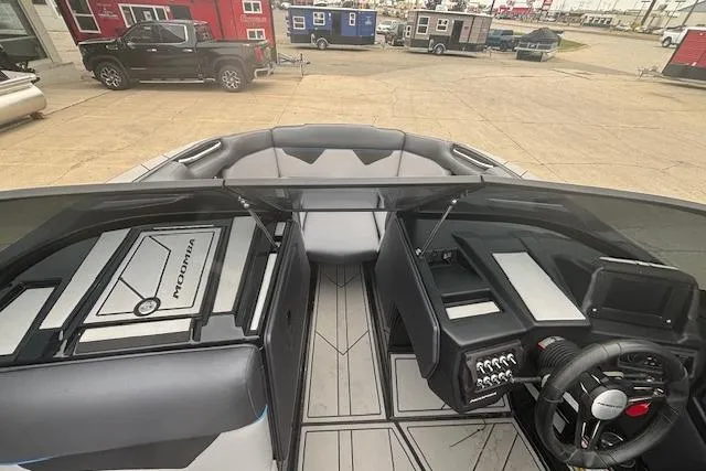 Slide: The Image of 2022 Moomba Kaiyen boat interior with modern dashboard and seating. - 29