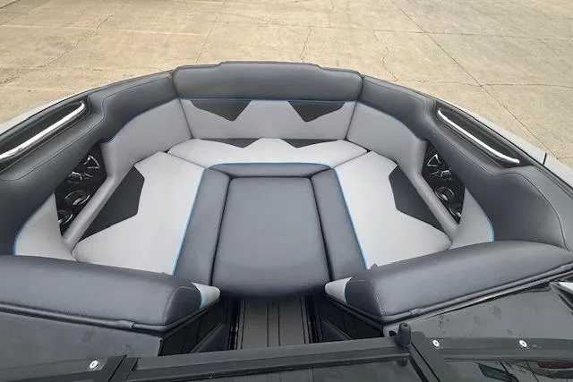 Slide: The Image of 2022 Moomba Kaiyen boat interior with gray and black seating, featuring modern design. - 30