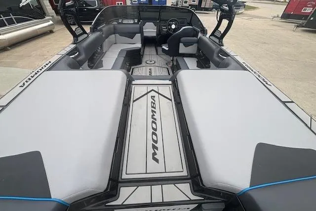 Slide: The Image of 2022 Moomba Kaiyen boat interior with spacious seating and modern design. - 9