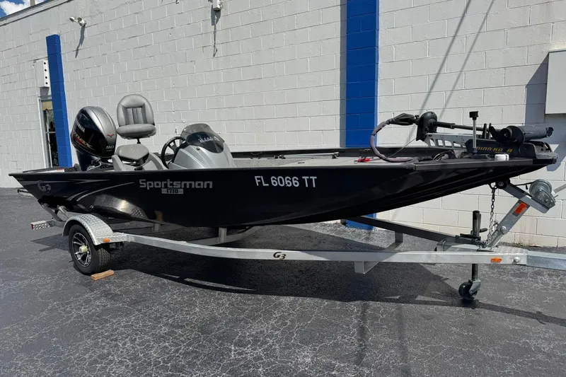 The Image of 2023 G3 Sportsman 1710 fishing boat on trailer, parked outdoors. - 0