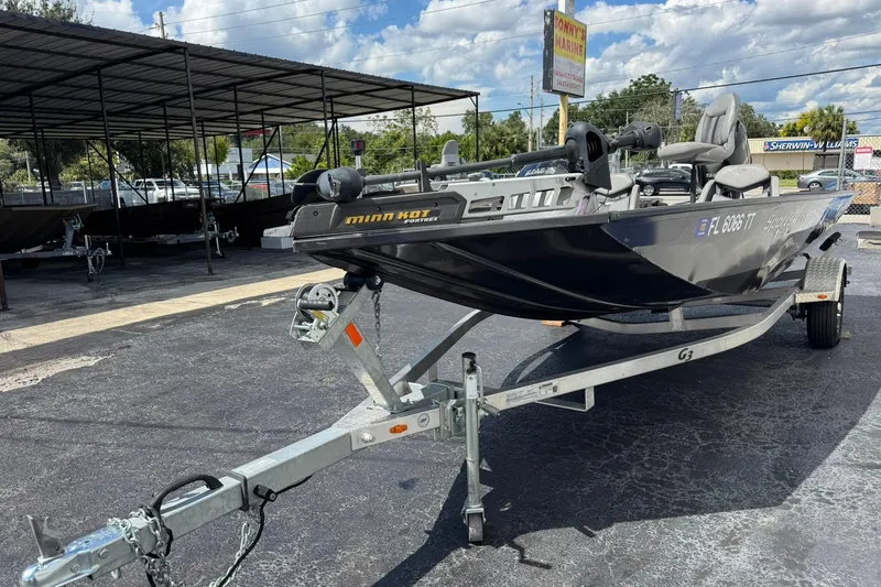 Slide: The Image of 2023 G3 Sportsman 1710 boat on trailer in outdoor dealership lot. - 2
