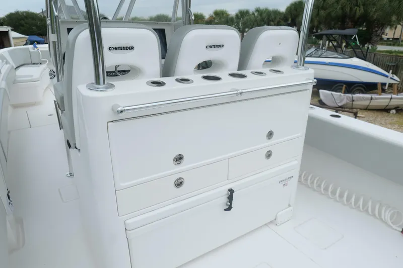 Slide: The Image of 2024 Contender 35 ST boat interior with seating and storage compartments. - 12