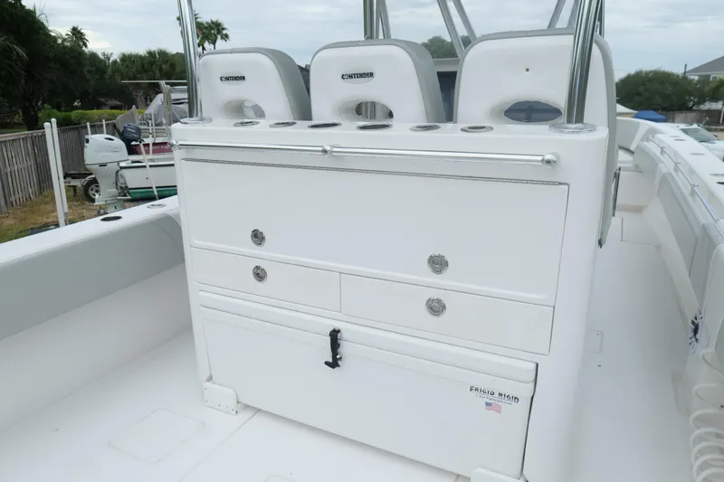 Slide: The Image of 2024 Contender 35 ST boat interior with seating and storage compartments. - 15