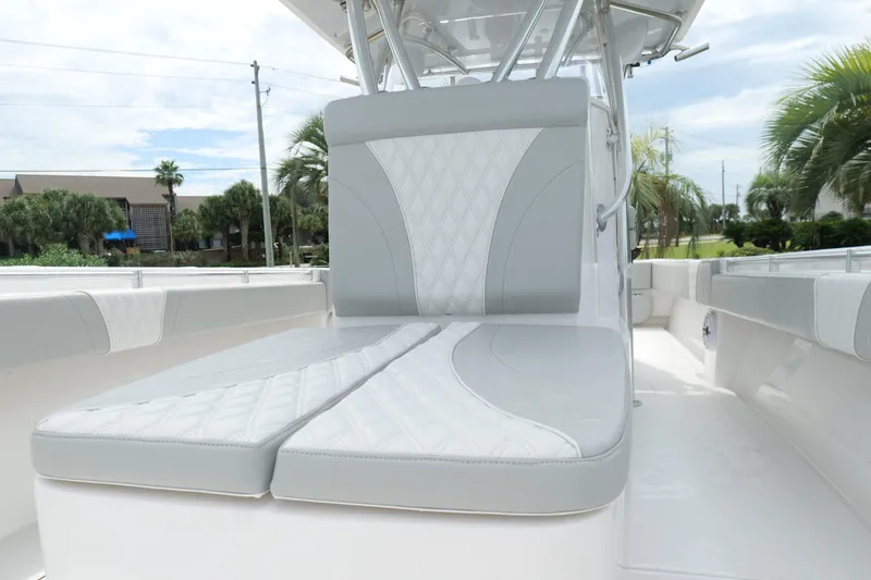 Slide: The Image of 2024 Contender 35 ST boat interior with cushioned seating and sleek design. - 31