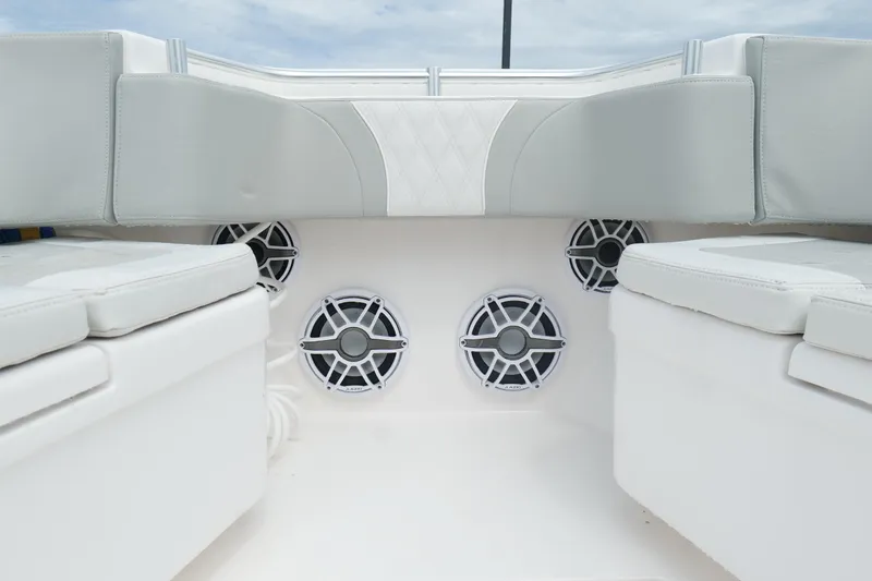 Slide: The Image of 2024 Contender 35 ST boat interior with cushioned seating and built-in speakers. - 32