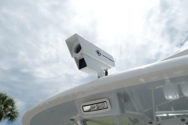 Slide: The Image of 2024 Contender 35 ST boat with NiteTrack camera system under cloudy sky. - 37