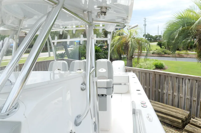 Slide: The Image of 2024 Contender 35 ST boat with sleek design, featuring polished metal framework and comfortable seating. - 41