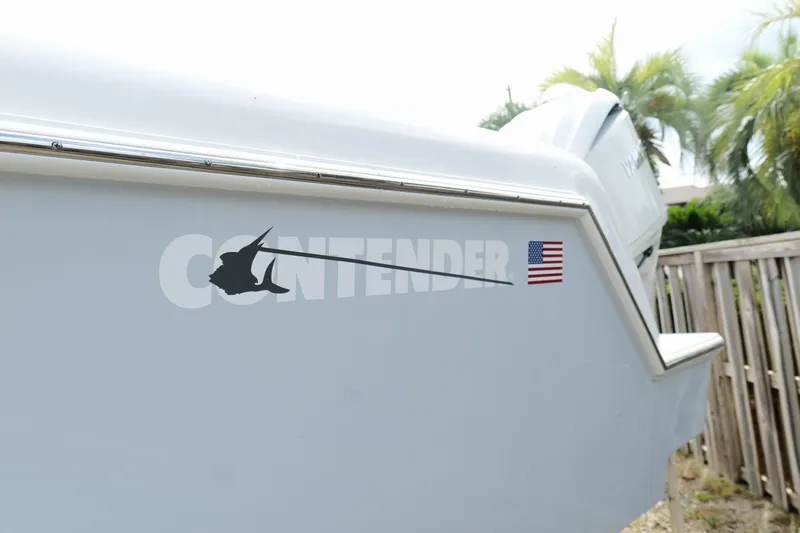 Slide: The Image of 2024 Contender 35 ST boat with logo and American flag decal. - 5