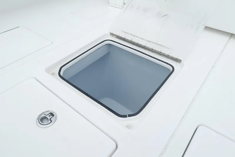 Slide: The Image of 2024 Contender 35 ST boat storage compartment with open hatch. - 9