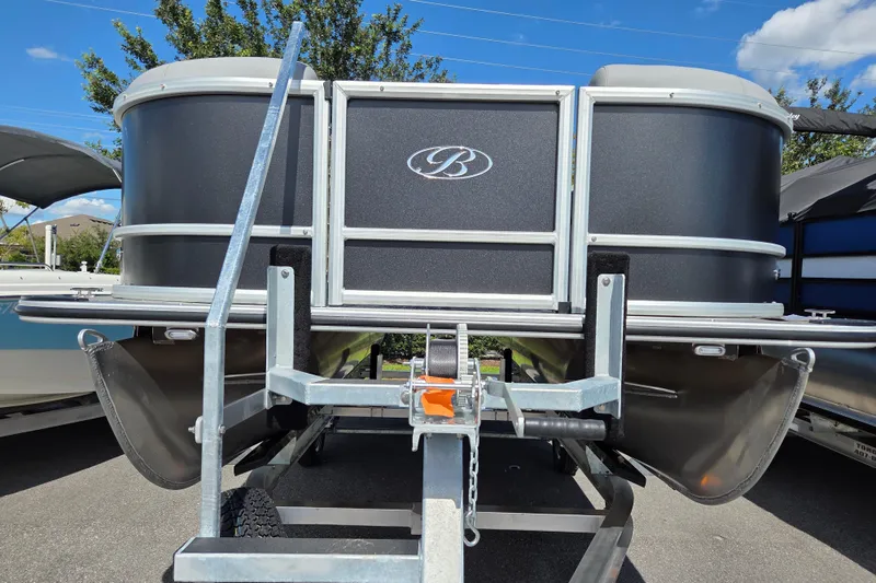The Image of 2026 Bentley Pontoons LE 180 Cruise on trailer, showcasing sleek design under blue sky. - 1