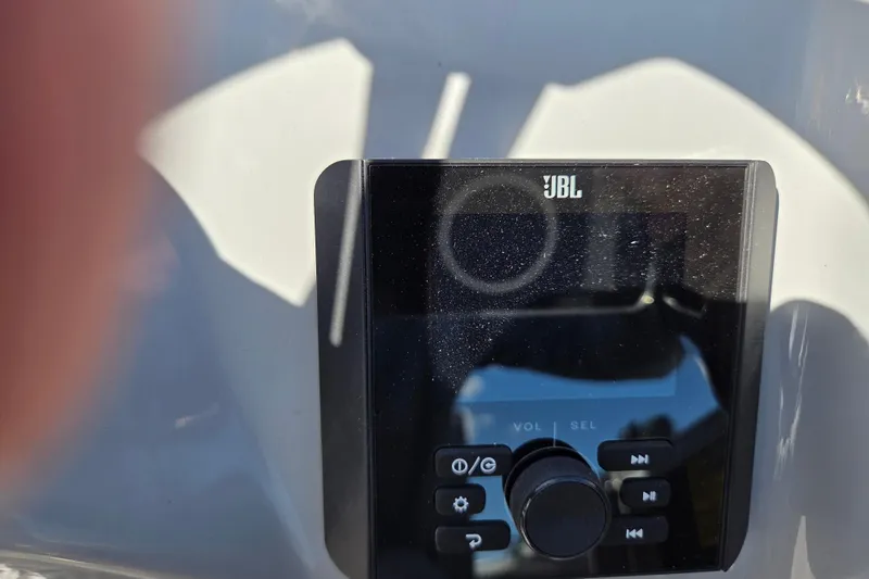 Slide: The Image of JBL audio system on 2026 Bentley Pontoons LE 180 Cruise boat dashboard. - 12