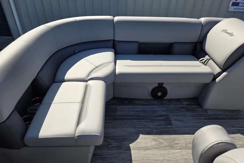 Slide: The Image of 2026 Bentley Pontoons LE 180 Cruise interior with gray seating and cup holders. - 14