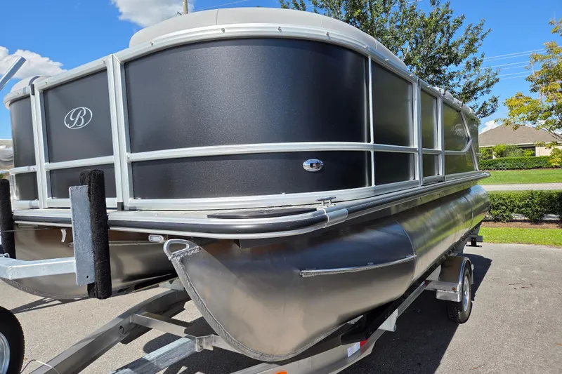 Slide: The Image of 2026 Bentley Pontoons LE 180 Cruise on trailer, sleek design under clear blue sky. - 3