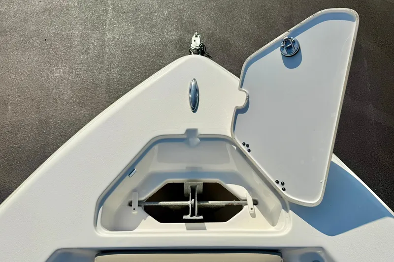Slide: The Image of Bow anchor compartment of 2022 Key West 219 FS boat, open hatch view. - 19