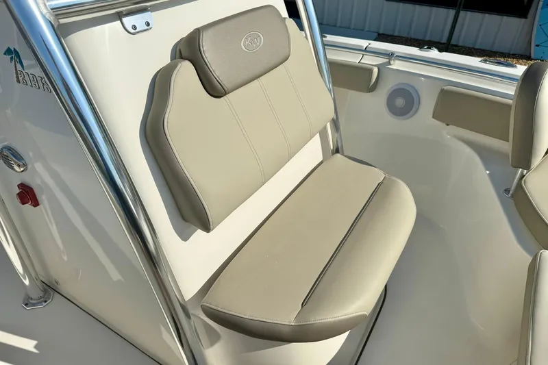 Slide: The Image of 2022 Key West 219 FS boat seat with beige upholstery and stainless steel frame. - 20
