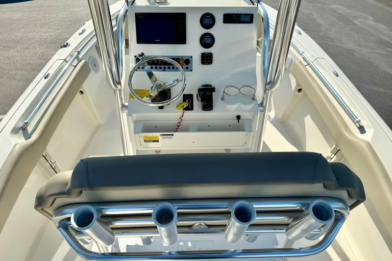 Slide: The Image of 2022 Key West 219 FS boat console with steering wheel and controls. - 24