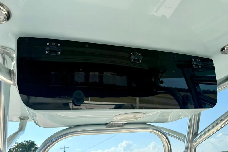 Slide: The Image of 2022 Key West 219 FS boat console with mounted black panel and stainless steel frame. - 28