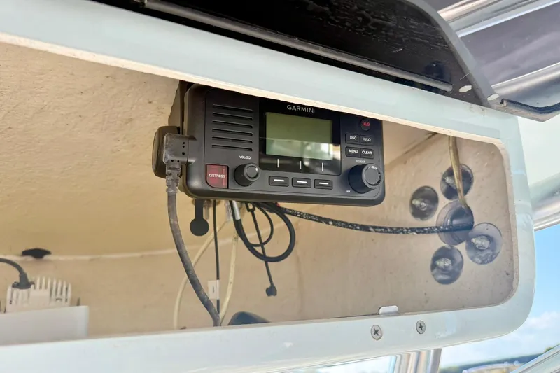 Slide: The Image of Garmin marine radio installed on 2022 Key West 219 FS boat dashboard. - 30