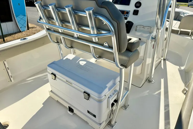 Slide: The Image of 2022 Key West 219 FS boat interior with seating and cooler storage. - 33