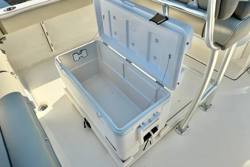 Slide: The Image of 2022 Key West 219 FS boat with open storage compartment on deck. - 35