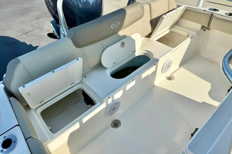 Slide: The Image of 2022 Key West 219 FS boat interior with open storage compartments and seating. - 39