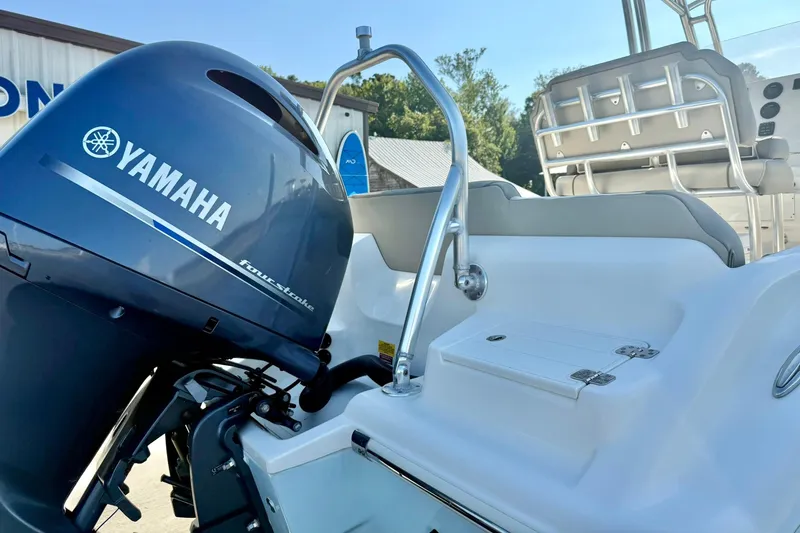 Slide: The Image of 2022 Key West 219 FS boat with Yamaha four-stroke engine, featuring sleek seating and controls. - 46