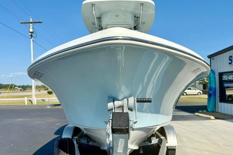 Slide: The Image of 2022 Key West 219 FS boat on trailer, front view, sunny day. - 8