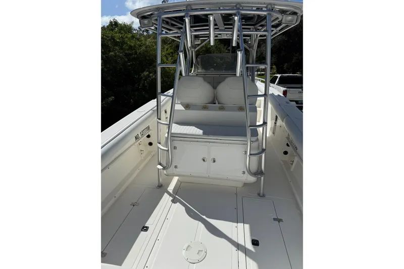 Slide: The Image of 2001 Marlago 35 Cuddy boat interior with seating and metal framework. - 11