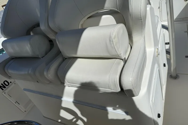 Slide: The Image of White leather seating on a 2001 Marlago 35 Cuddy boat, showcasing luxury and comfort. - 12