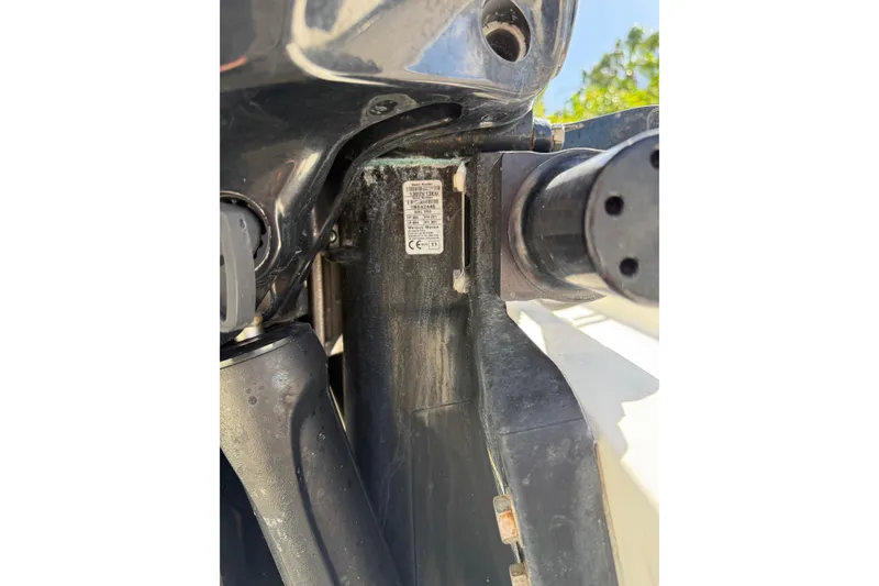 Slide: The Image of Close-up of a 2001 Marlago 35 Cuddy boat engine component with visible serial number. - 27