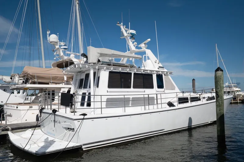 The Image of 2007 Pilot Cruiser Expedition yacht docked at marina under clear blue sky. - 0