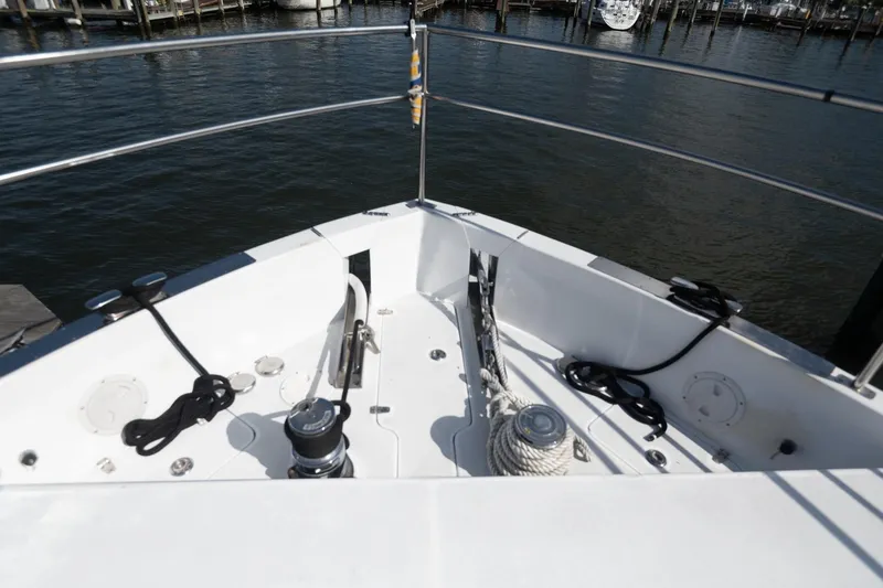 Slide: The Image of Bow of 2007 Pilot Cruiser Expedition boat with ropes and winch, docked at marina. - 10