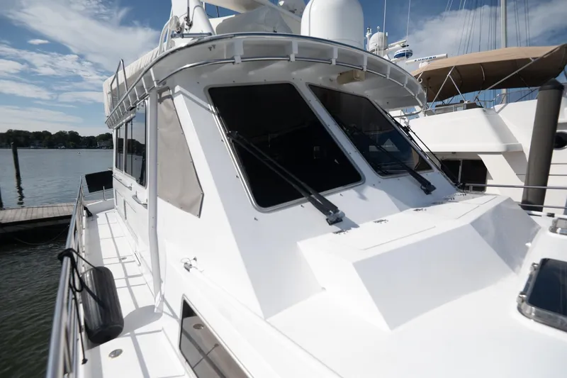 Slide: The Image of 2007 Pilot Cruiser Expedition yacht docked at marina under clear blue sky. - 11