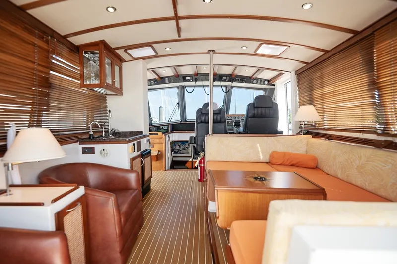 Slide: The Image of Luxurious interior of 2007 Pilot Cruiser Expedition yacht with leather seating and wooden accents. - 15