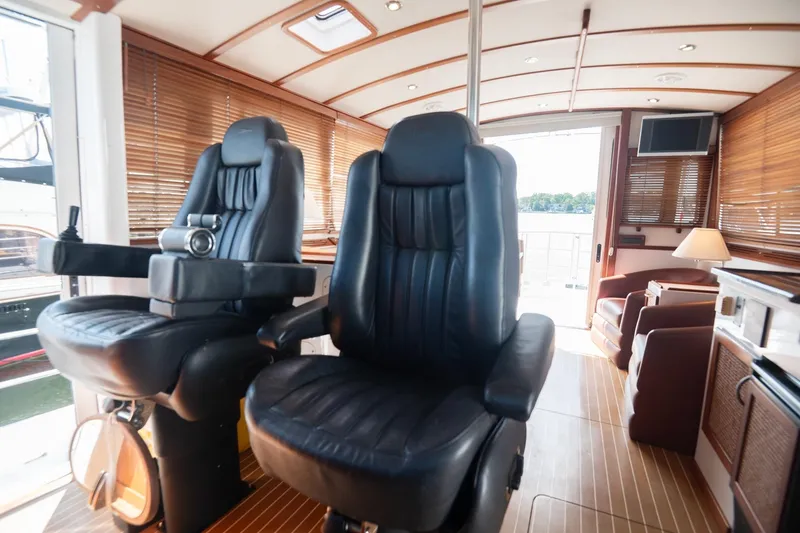 Slide: The Image of Luxurious interior of 2007 Pilot Cruiser Expedition yacht with leather seating and wooden accents. - 22