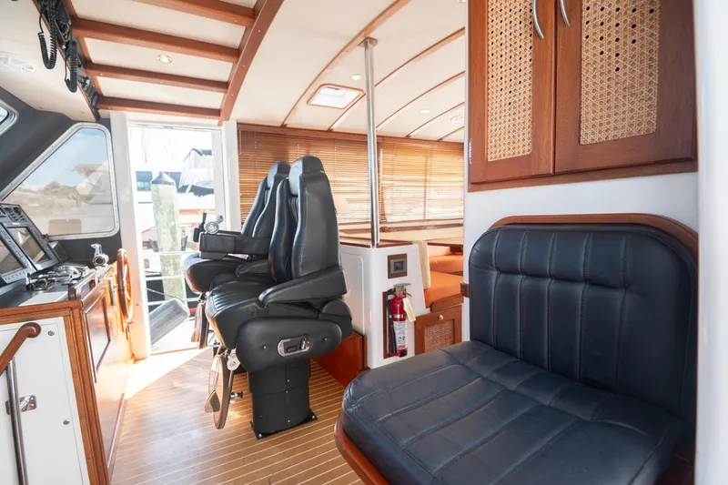 Slide: The Image of Interior of 2007 Pilot Cruiser Expedition yacht with leather seating and wooden accents. - 25