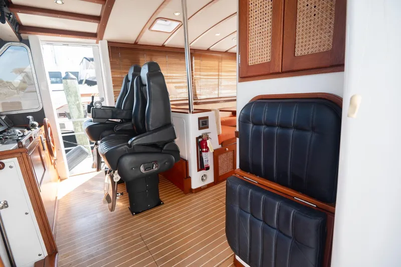 Slide: The Image of Luxurious 2007 Pilot Cruiser Expedition yacht interior with leather seating and wooden accents. - 26