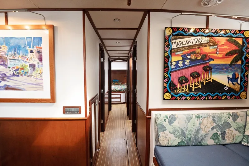 Slide: The Image of Interior of 2007 Pilot Cruiser Expedition yacht with vibrant artwork and cozy seating area. - 38