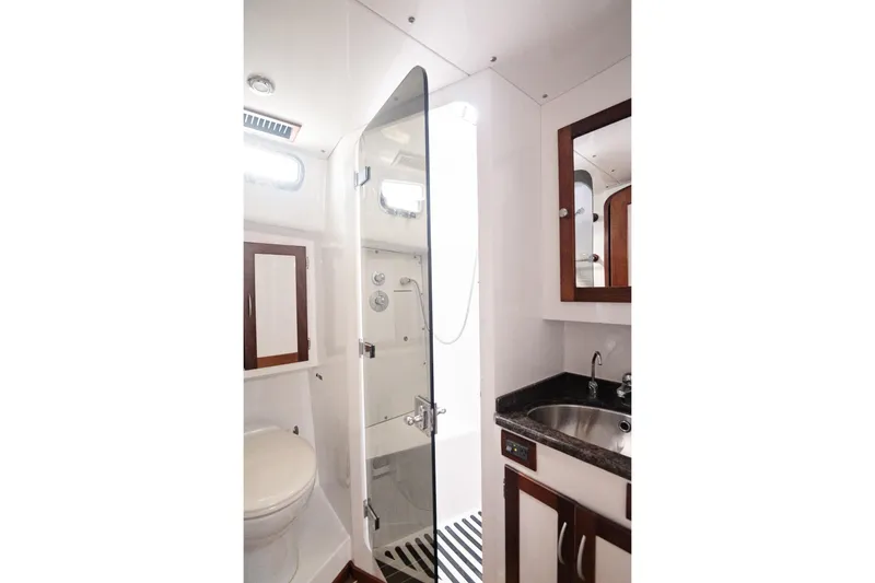 Slide: The Image of Bathroom interior of 2007 Pilot Cruiser Expedition yacht with shower, sink, and toilet. - 40