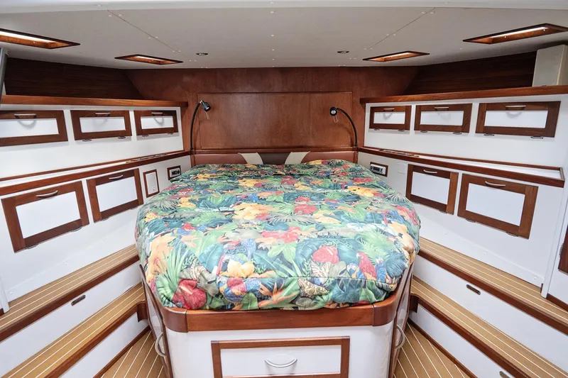 Slide: The Image of Luxurious 2007 Pilot Cruiser Expedition cabin with vibrant bedding and ample storage. - 43