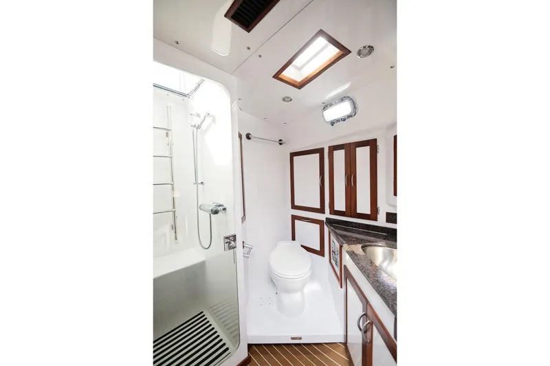 Slide: The Image of Bathroom interior of 2007 Pilot Cruiser Expedition yacht, featuring shower, toilet, and sink. - 45