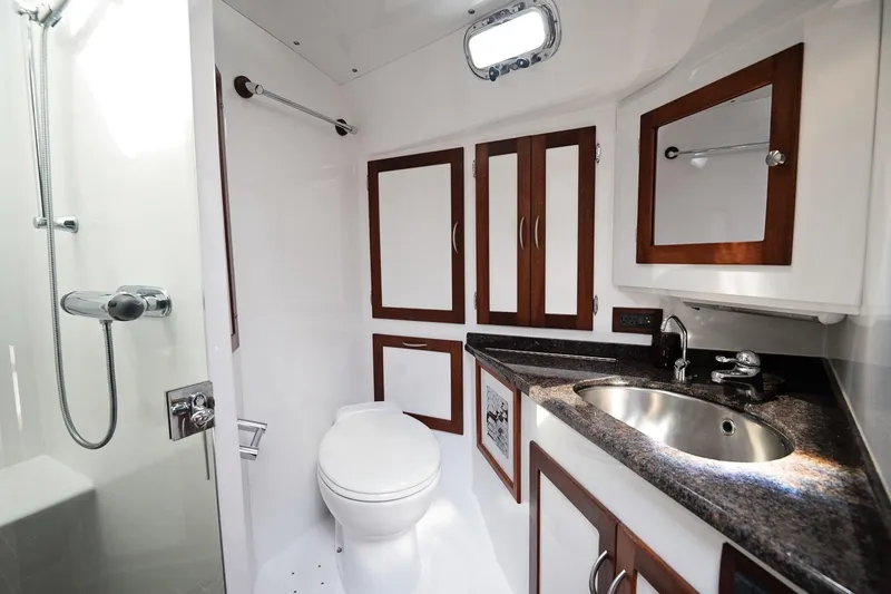 Slide: The Image of Luxurious 2007 Pilot Cruiser Expedition yacht bathroom with modern fixtures and elegant wood accents. - 46