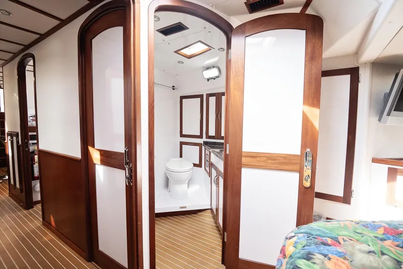Slide: The Image of Luxurious 2007 Pilot Cruiser Expedition yacht interior with wooden doors and modern bathroom. - 47