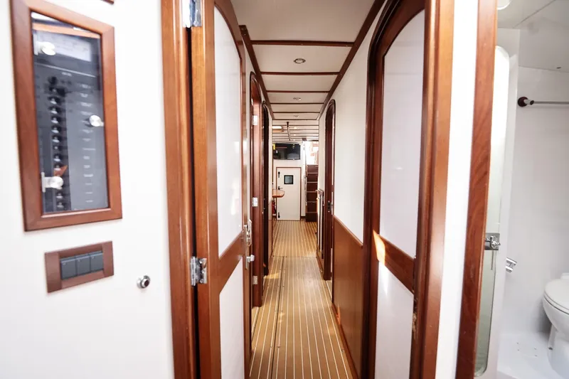 Slide: The Image of Interior hallway of 2007 Pilot Cruiser Expedition yacht with wooden doors and paneling. - 48