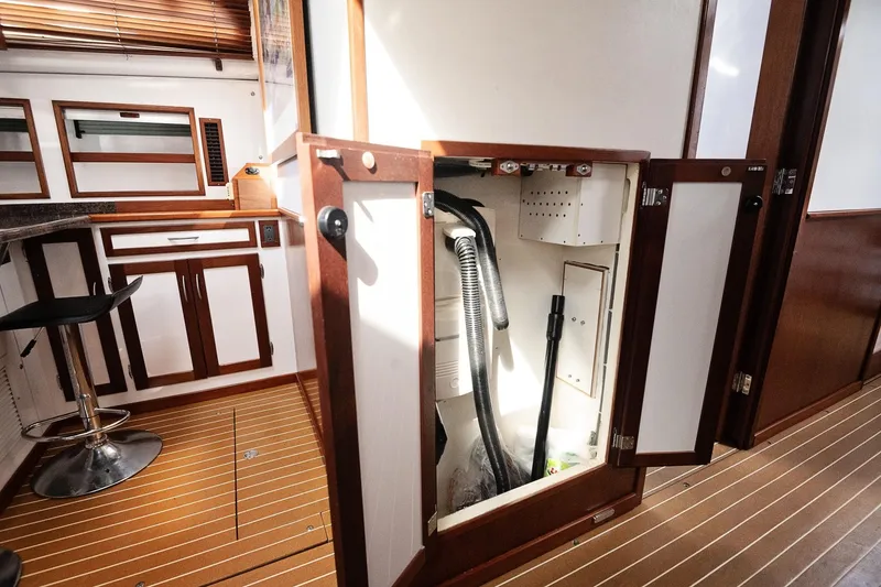 Slide: The Image of 2007 Pilot Cruiser Expedition yacht interior with open cabinet and modern kitchen design. - 50