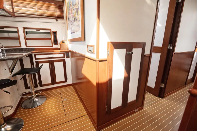 Slide: The Image of 2007 Pilot Cruiser Expedition yacht interior with wood paneling and modern kitchen area. - 51