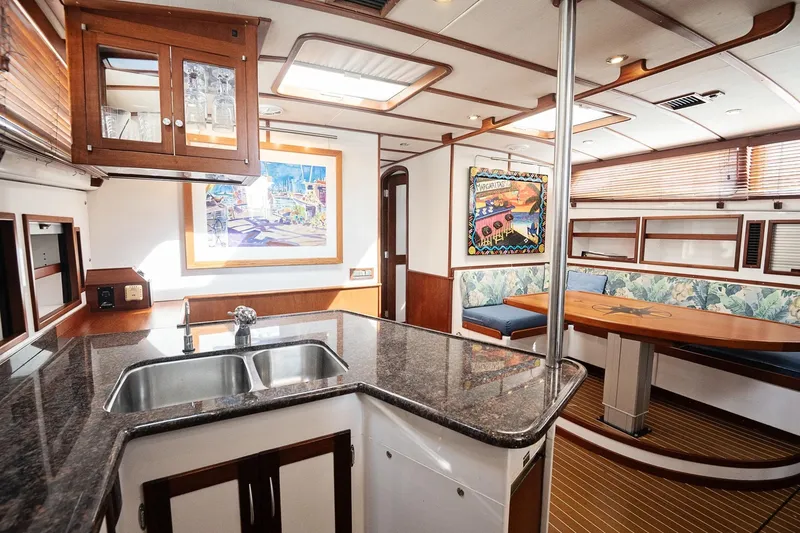 Slide: The Image of Luxurious 2007 Pilot Cruiser Expedition yacht interior with modern kitchen and cozy dining area. - 52