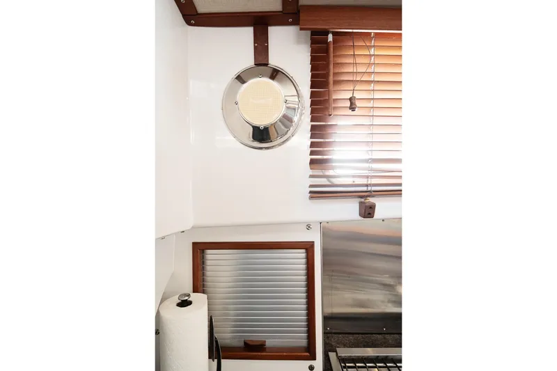 Slide: The Image of Interior of 2007 Pilot Cruiser Expedition with wooden blinds and nautical decor. - 55