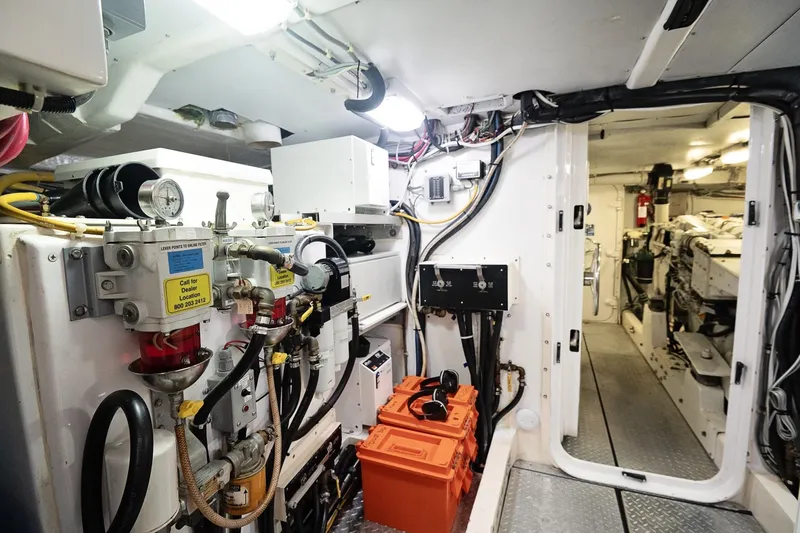 Slide: The Image of Engine room of a 2007 Pilot Cruiser Expedition yacht, showcasing machinery and equipment. - 58