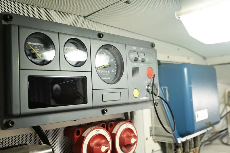 Slide: The Image of Control panel of a 2007 Pilot Cruiser Expedition boat with gauges and switches. - 68